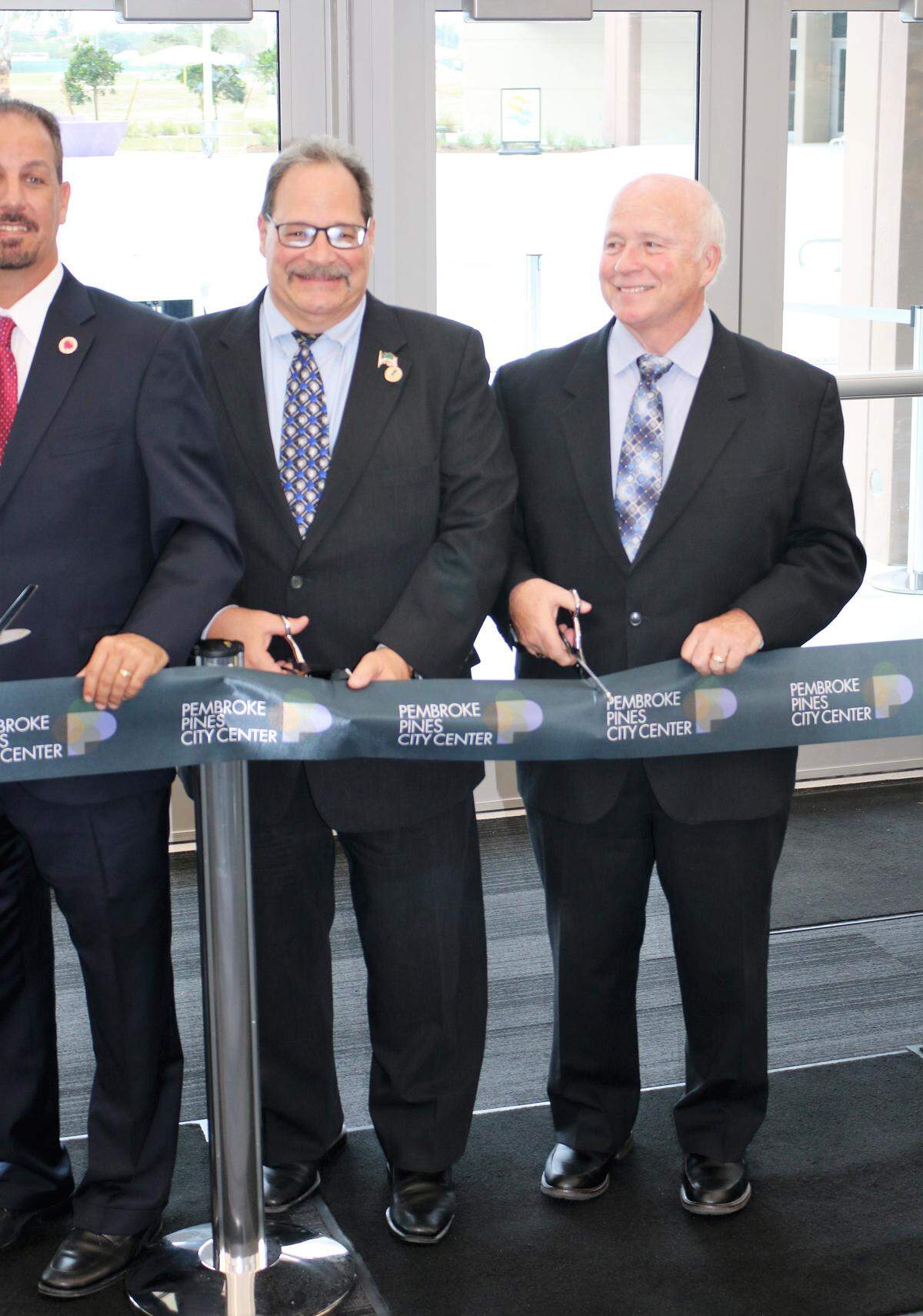 Charles F. Dodge, right, during the April 2017 ribbon cutting ceremony for the Charles F. Dodge City Center, located at 601 City Center Way.