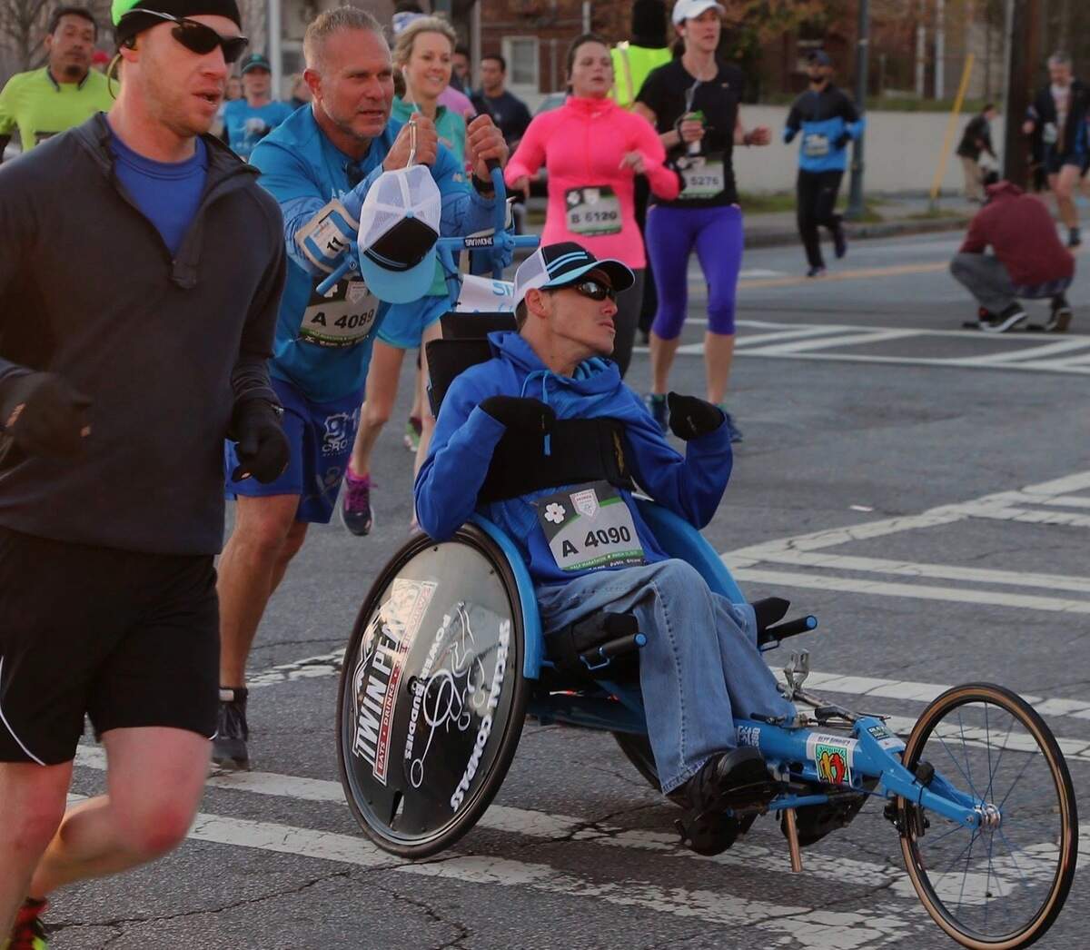 Michael Sayih and his father, Jim Sayih, are the heads of Special Compass, a Pembroke Pines-based nonprofit that pairs volunteer athletes with those of limited abilities.