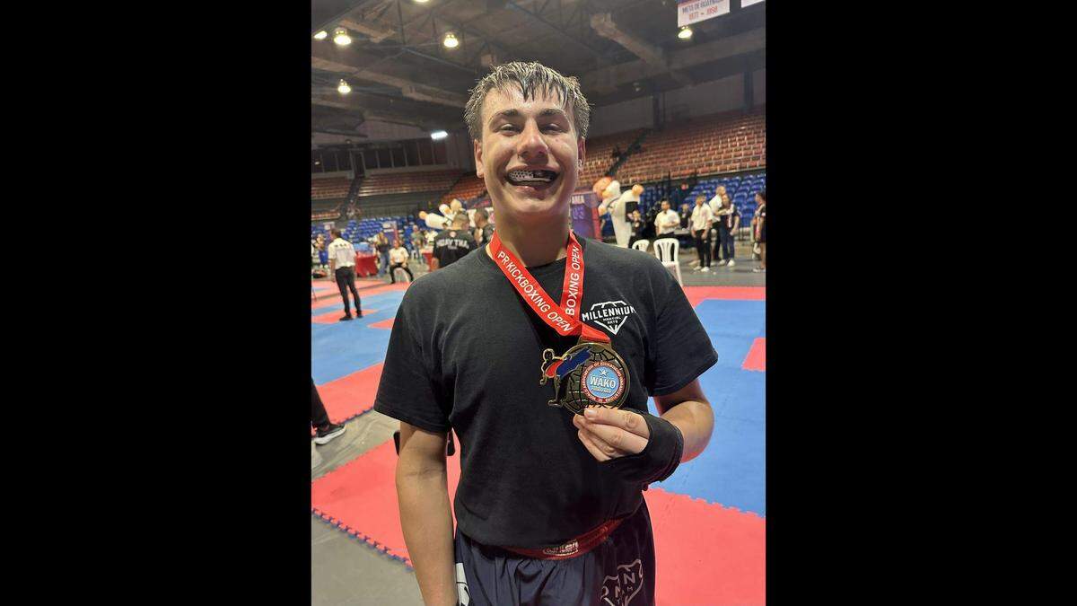 Ryan Velez, 16, poses with a gold medal he won in light contact kickboxing at WAKO’s 2025 Puerto Rico Open.