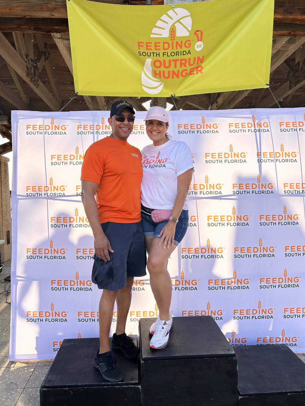 Charles Woods and Elizabeth Ramon at a Feeding South Florida food drive event.