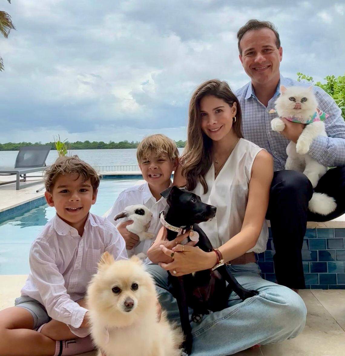 The Kordi family with Lulu, center, and their pets.