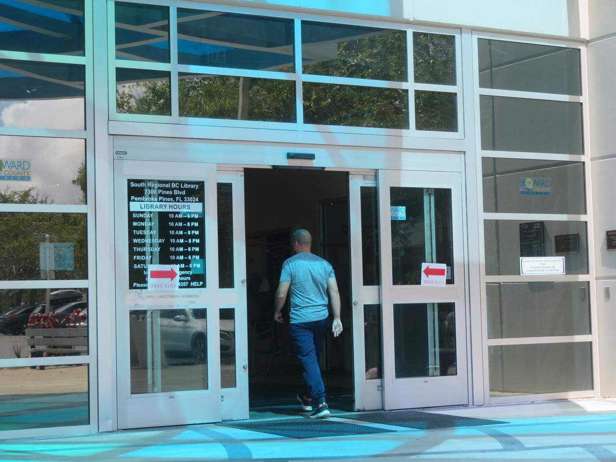 A man enters the South Regional/Broward College Library polling site, located at 7300 Pines Blvd., to cast a ballot for the municipal election.
