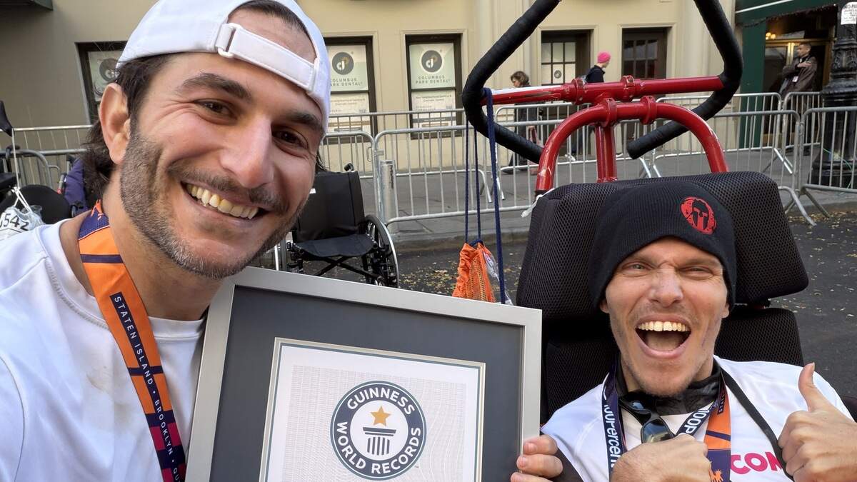 Max Fink, left, and Michael Sayih were awarded the Guinness World Records certificate for being the youngest wheelchair duo to complete the six World Marathon Majors at the 2025 Tokyo Marathon.