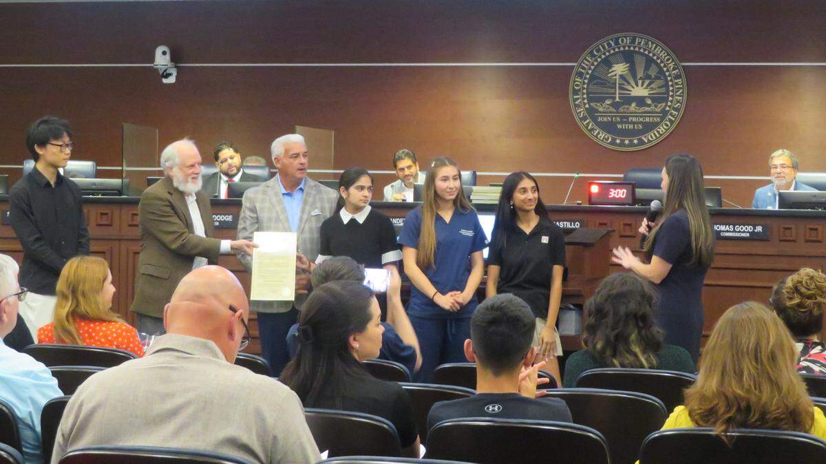 The Broward Sierra Group Junior Team receives a city proclamation from Mayor Angelo Castillo and District 3 Commissioner Maria Rodriguez during the Wednesday, Nov. 19, 2025 city commission meeting.