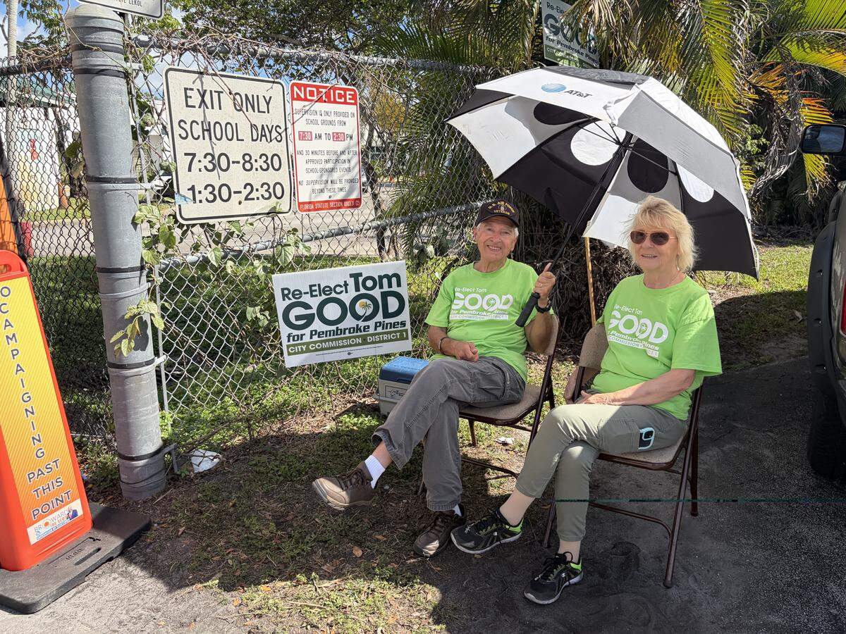 George Koren, left, and Kit Jordan, canvassers for District 1 candidate Tom Good.