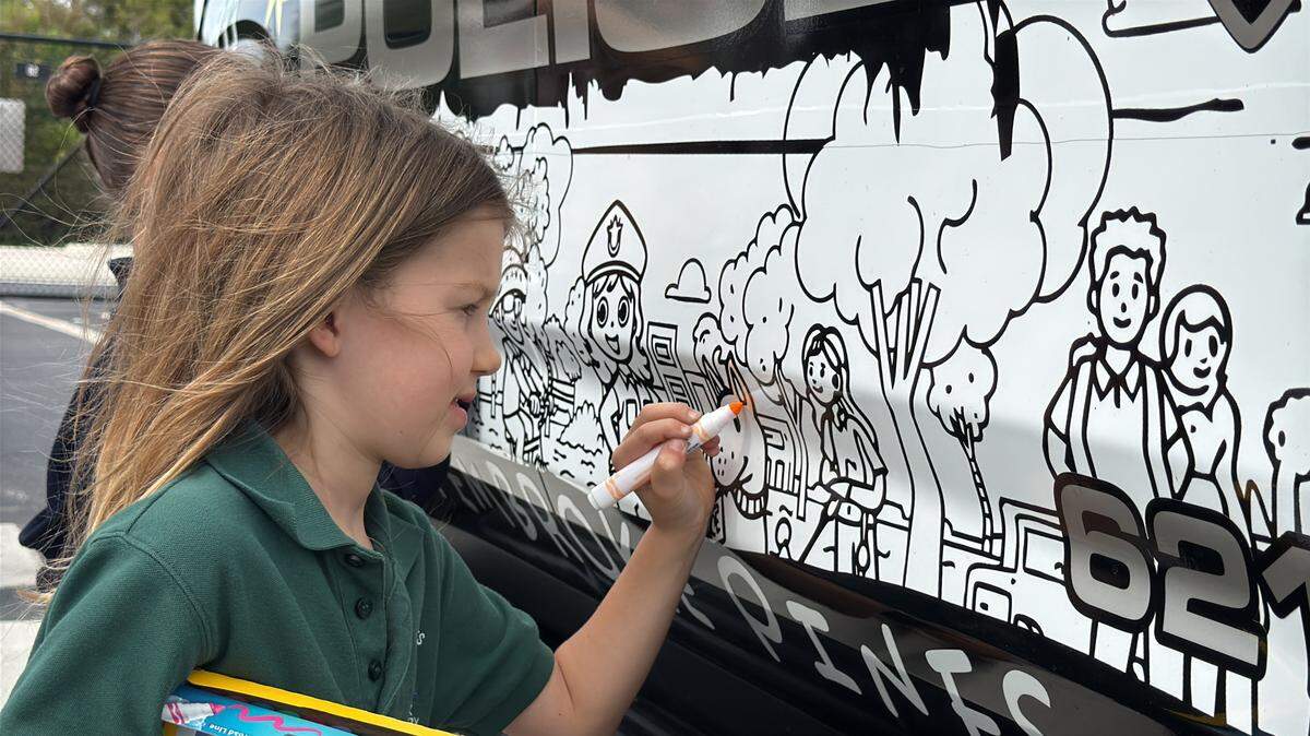 The agency debuted its new “Interactive Youth Engagement vehicle,” a patrol car featuring artwork from local elementary school students, to community members on Nov. 4.