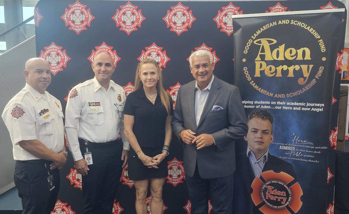 From left to right: Pembroke Pines Deputy Fire Chief Frank Martin, Fire Chief Marcelino Rodriguez, Sarah Perry and Mayor Angelo Castillo.
