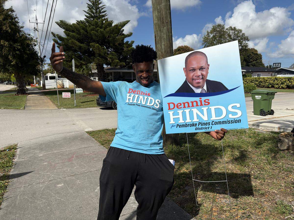 Simeal Burke, a canvasser for District 1 candidate Dennis Hinds, at Pembroke Pines Elementary School.