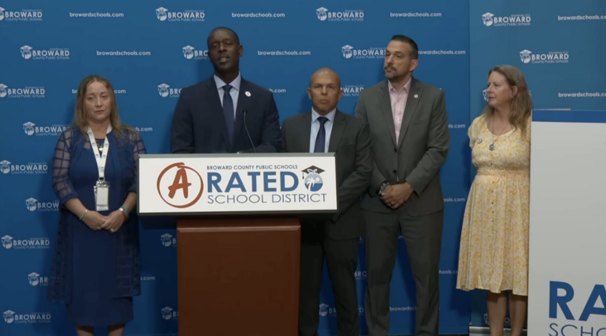 Broward County Public Schools Superintendent Howard Hepburn and school board members celebrate the district’s third consecutive A rating during a July 1 news conference at the Kathleen C. Wright Administration Center in Fort Lauderdale.
