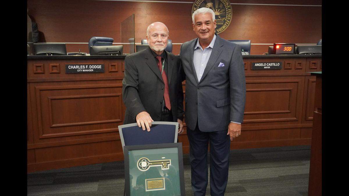 Pembroke Pines City Manager Charles F. Dodge, left, and Mayor Angelo Castillo, right.