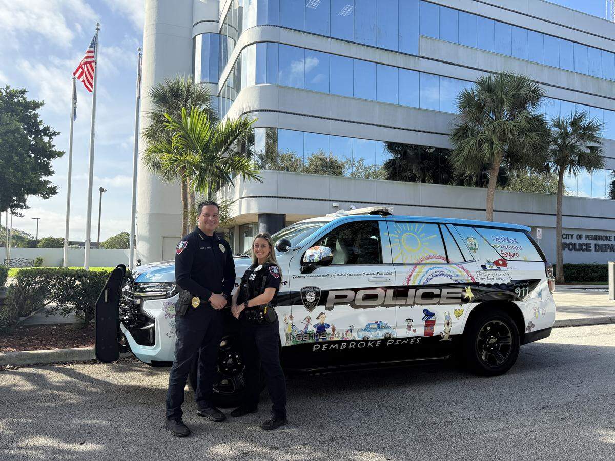 Chief Jose Vargas, left, and Community Affairs Officer Jenniffer Miro, right.