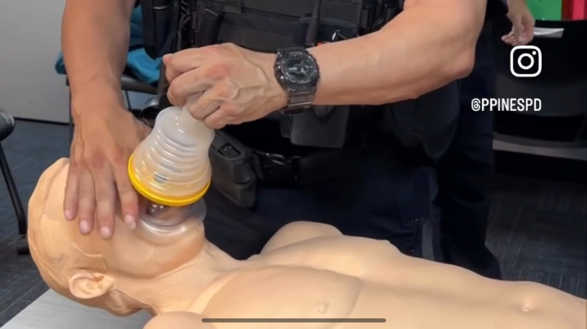 A Pembroke Pines police officer demonstrates how to use a LifeVac Rescue Suction Device.